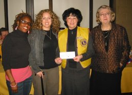 President Terry Fontana & Lydia Manget present cheque to Emily Stowe staff