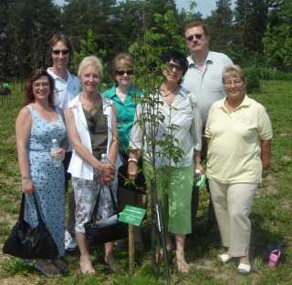 Jim's family and members of the Lions at a tree planting in his memory